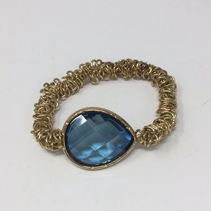 Stretchy wire bracelet with teal plastic stone